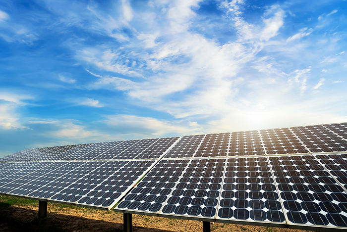 photovoltaic solar power panel on dramatic sunset blue sky background, green clean Alternative power energy concept.