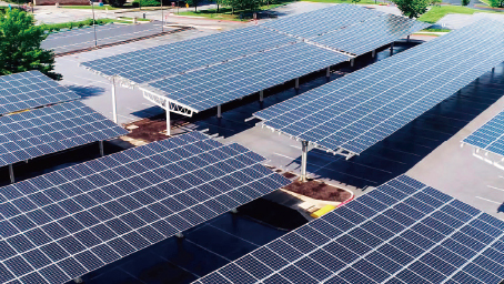 Overlooking the solar photovoltaic panels and agricultural planting temperature shed; Shutterstock ID 686542702