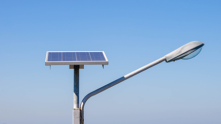 Overlooking the solar photovoltaic panels and agricultural planting temperature shed; Shutterstock ID 686542702