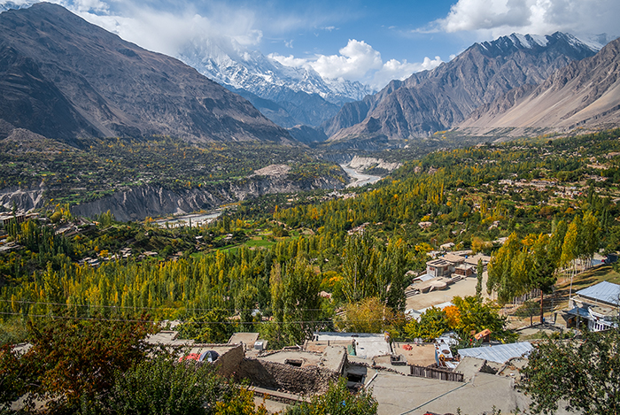 Landscape of peaceful Hunza Nagar valley in autumn with a view of snow capped Rakaposhi mountain in Karakoram range. Gilgit Baltistan, northern Pakistan.