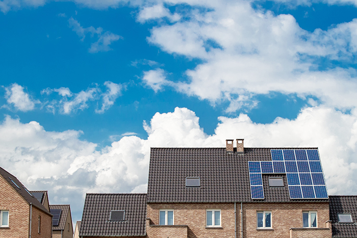 solar panels on the roof of a house. horizontal orientation, blue sky. Energy concept