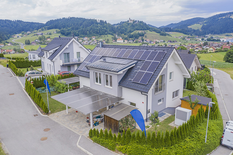 A high angle shot of a private house situated in a valley with solar panels on the roof; Shutterstock ID 1630183687